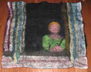 laid out my wool fibers onto black silk chiffon fabric and felted using soapy water and rubbing.